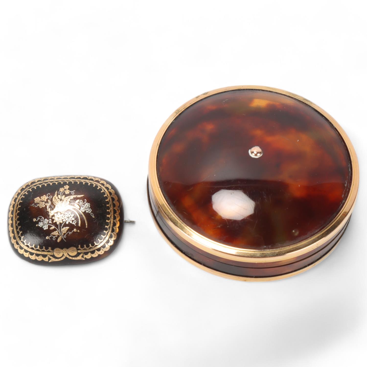 A 19th century circular tortoiseshell box with domed top and bottom, unmarked gilt-metal edges,