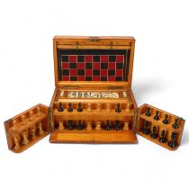 A 19th century pine game compendium containing Staunton pattern boxwood and ebonised chess set, bone