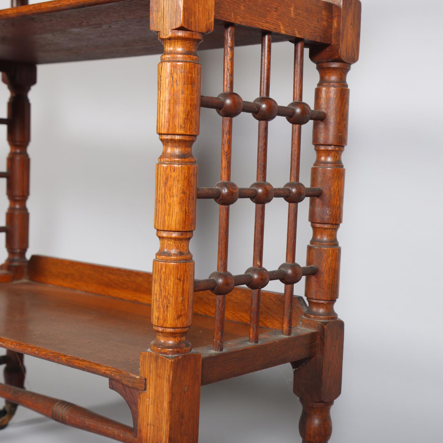 Leonard Wyburd for Liberty & Co, oak 3-tier library table, with bobbin spindle side panels, and - Image 2 of 3