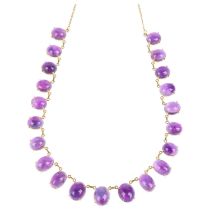 A 22ct gold graduated amethyst fringe necklace, claw set with oval cabochon amethysts, largest