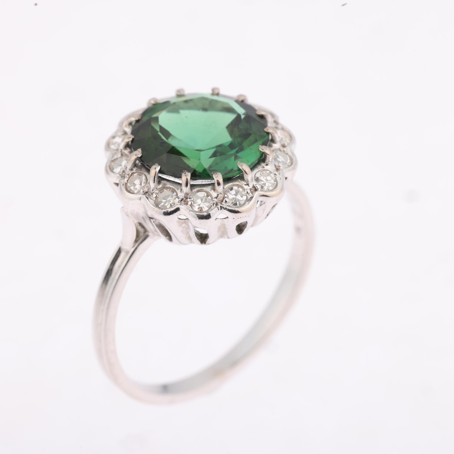 An 18ct white gold green tourmaline and diamond flowerhead cluster ring, centrally claw set with 3ct - Image 2 of 4