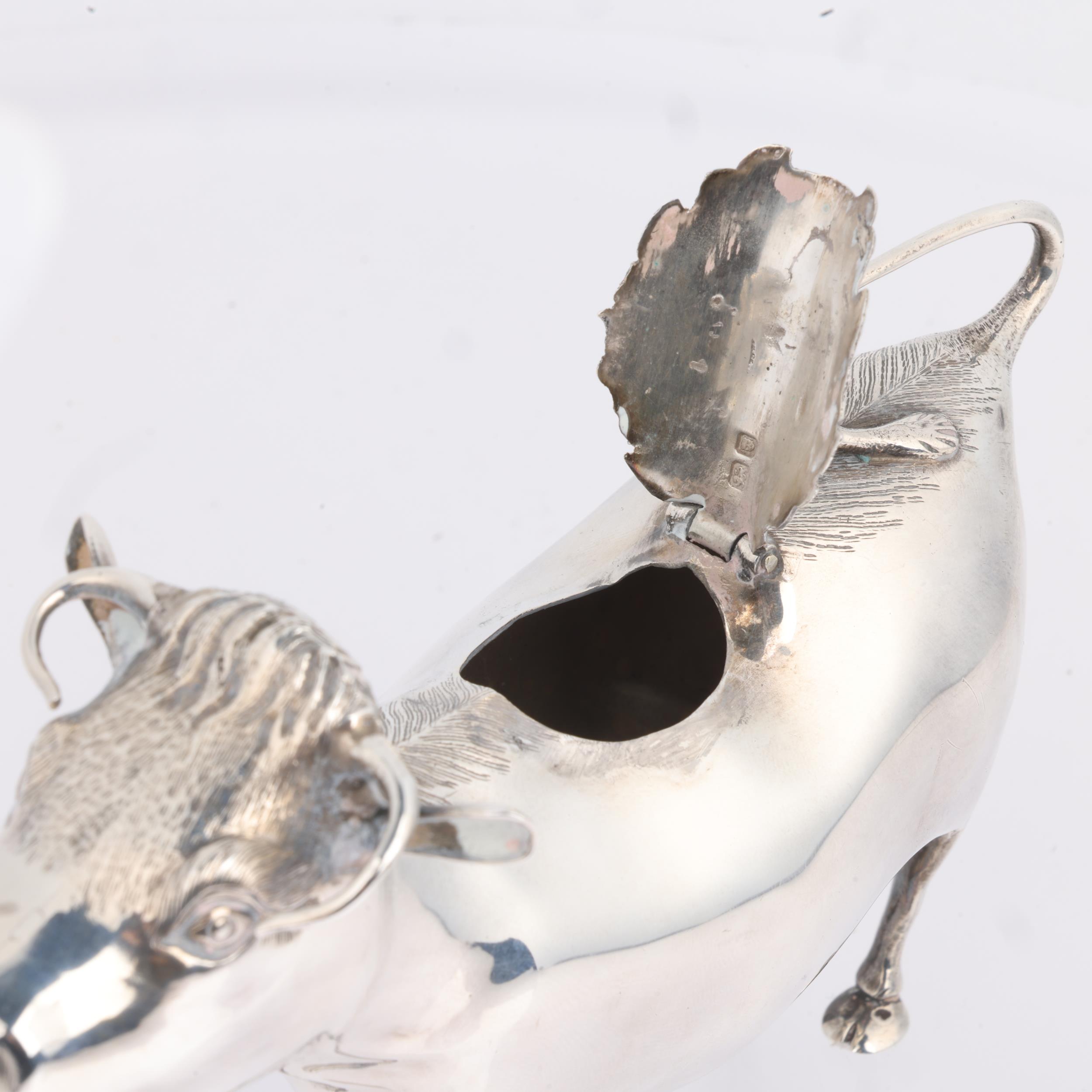 An Elizabeth II silver figural cow creamer jug, Searle & Co Ltd, London 1961, 15cm, 5oz No damage or - Image 2 of 3