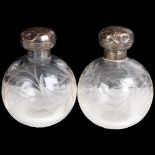 A pair of Edwardian silver-mounted glass globe dressing table scent bottles, indistinct maker,
