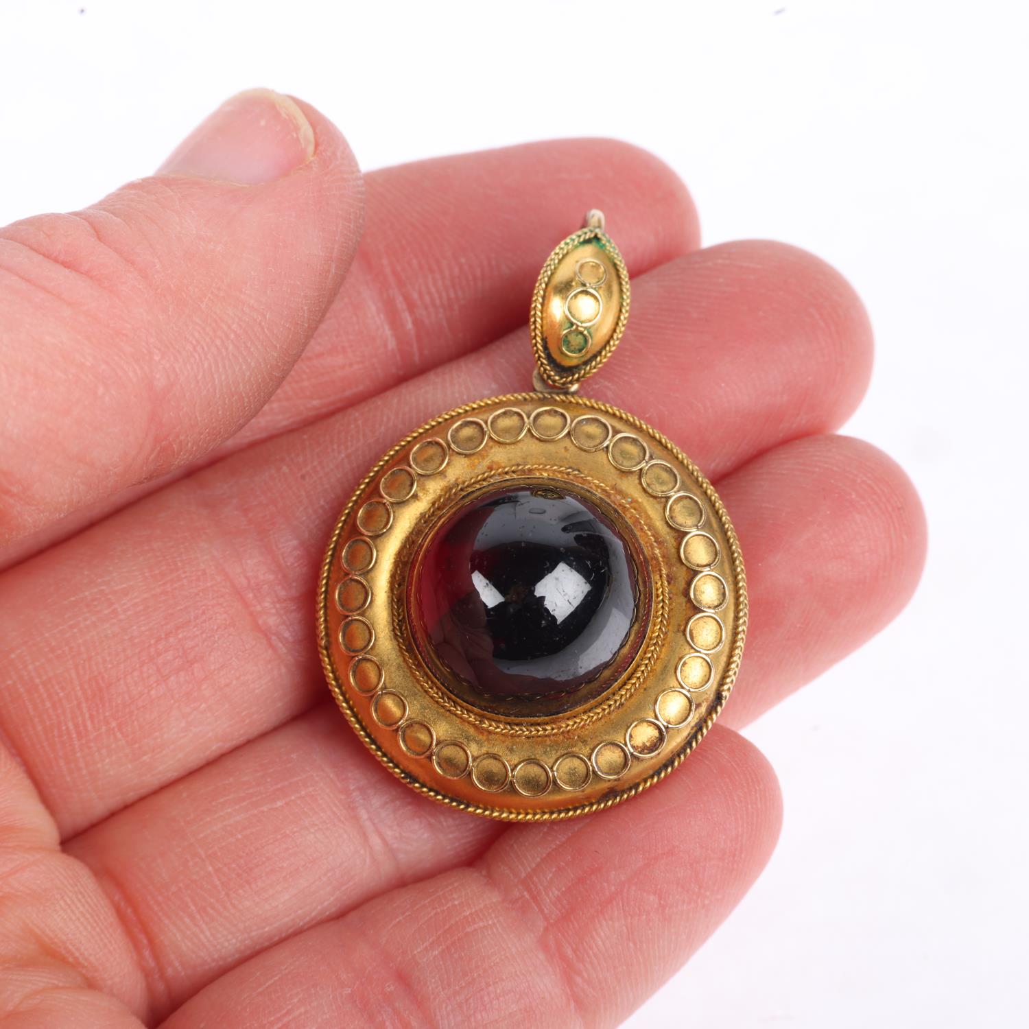 A Victorian Etruscan Revival garnet mourning locket pendant, circa 1880, centrally set with foil- - Image 4 of 4
