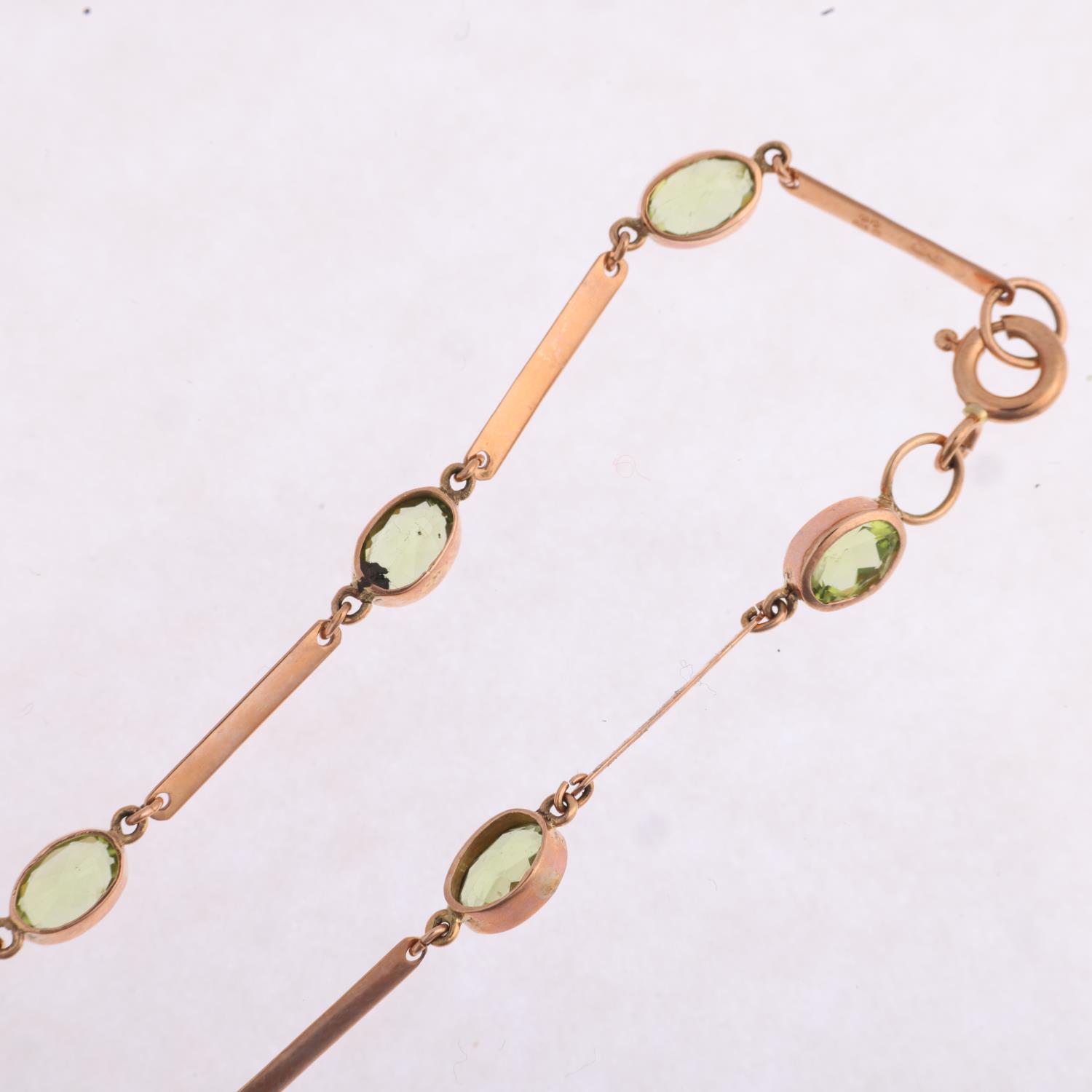 A 9ct rose gold peridot tennis line bracelet, maker SA, London 2011, rub-over set with oval mixed- - Image 3 of 4