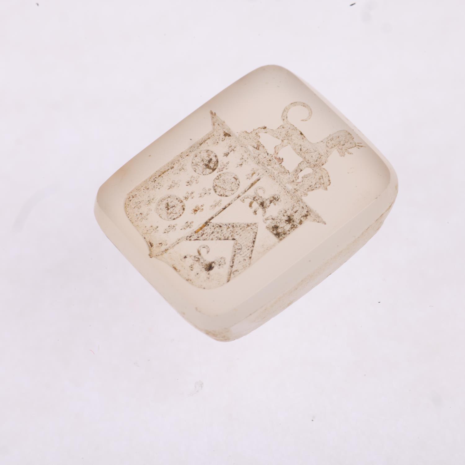 A 19th century chalcedony armorial seal ringstone, intaglio carved with shield banner surmounted - Image 2 of 4