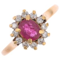 An 18ct gold ruby and diamond flowerhead cluster ring, claw set with oval mixed-cut ruby and