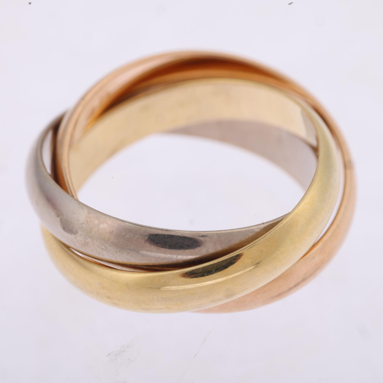 CARTIER - an 18ct three-colour gold Trinity ring, circa 2020, modelled as 3 entwined band rings, - Image 3 of 4