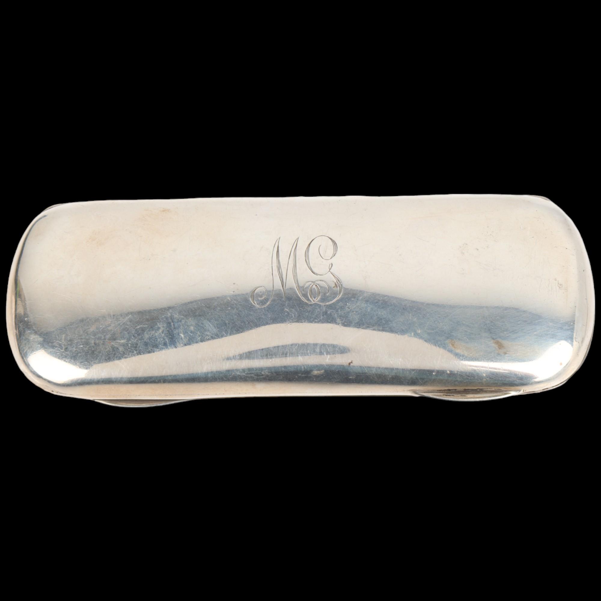 A George V silver spectacles case, Mappin & Webb, Birmingham 1919, oval form with gilt interior,