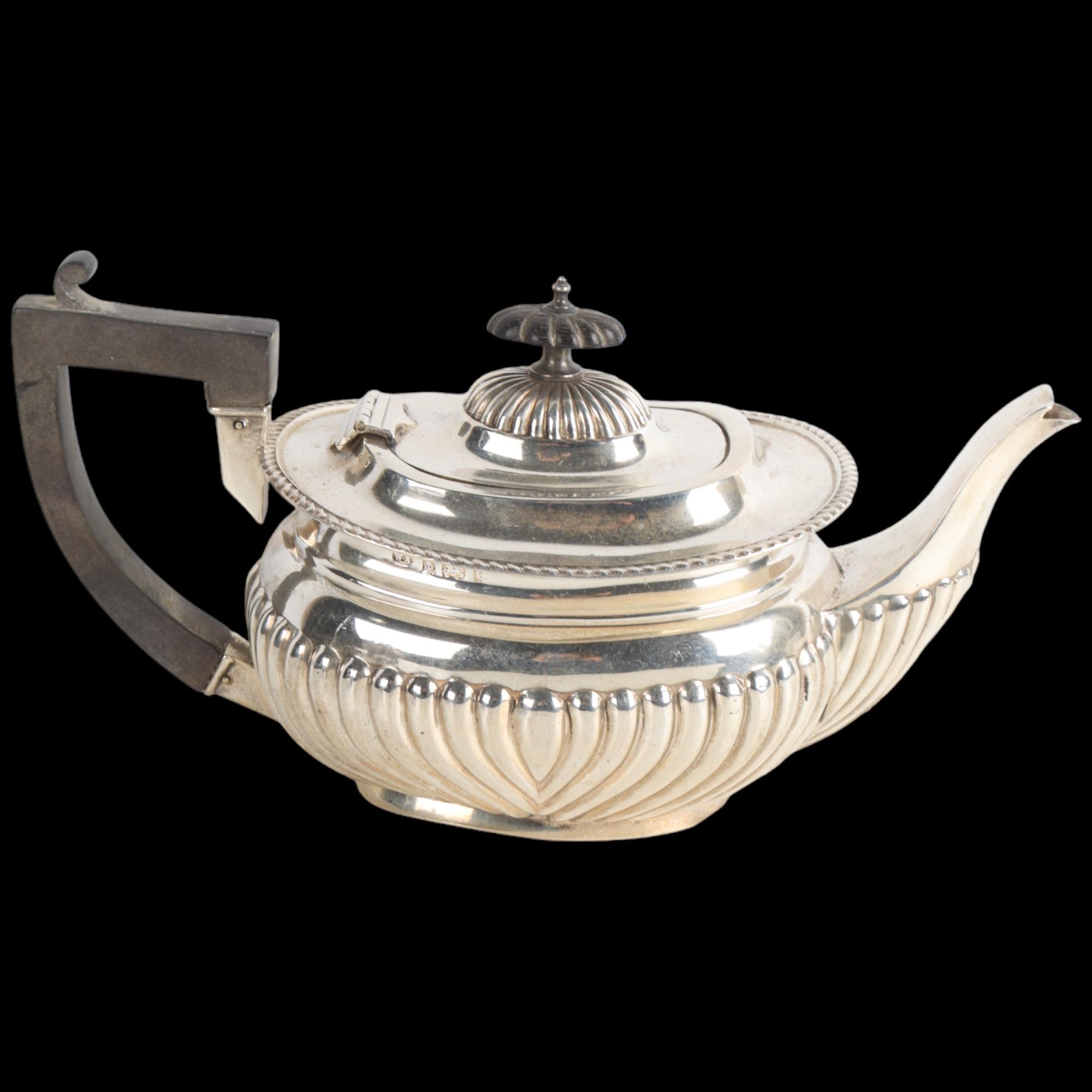 An Edwardian silver bachelor's teapot, William Aitken, Birmingham 1902, oval bulbous form with