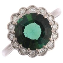 An 18ct white gold green tourmaline and diamond flowerhead cluster ring, centrally claw set with 3ct