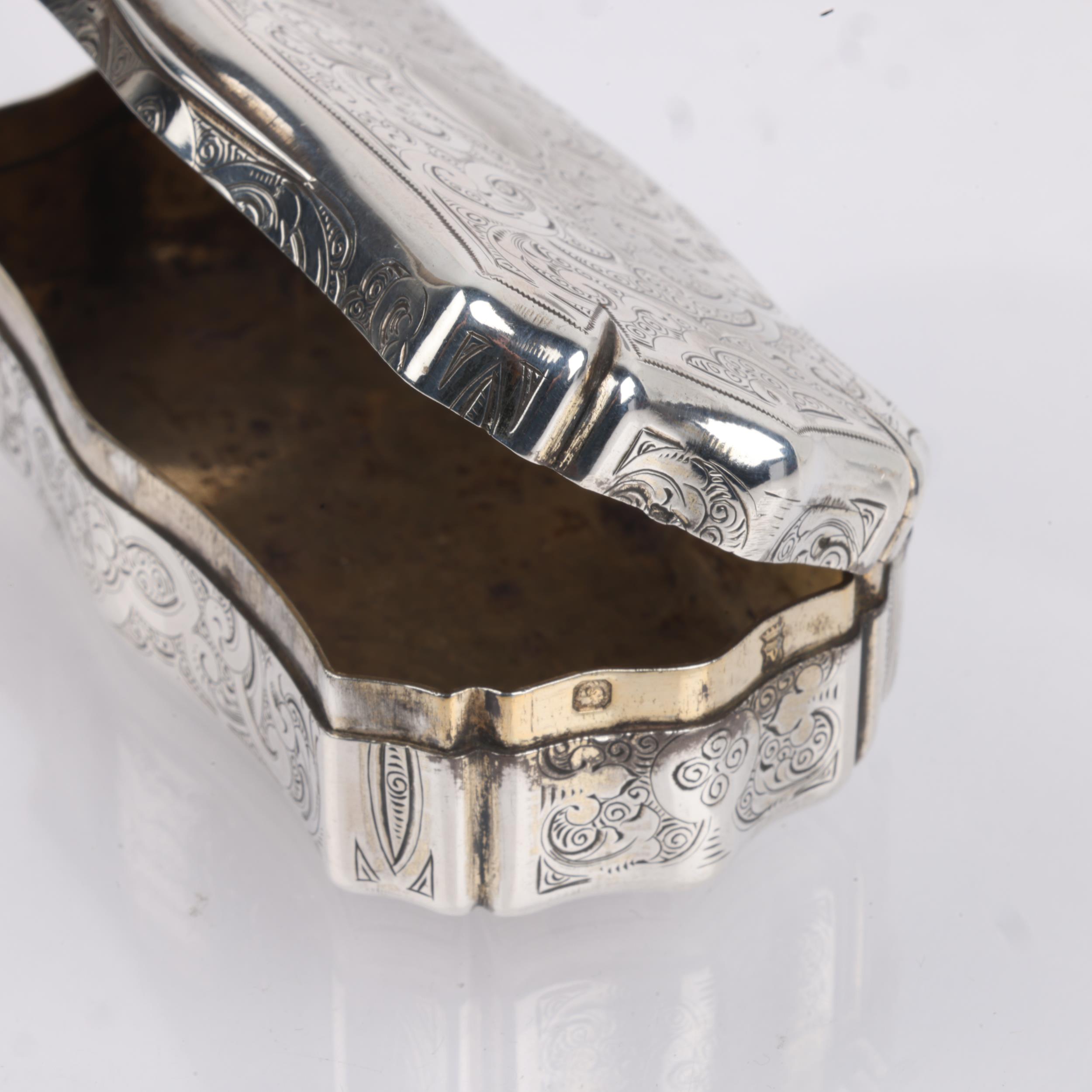 A 19th century French silver snuffbox, indistinct maker, shaped rectangular form, with allover - Image 3 of 3