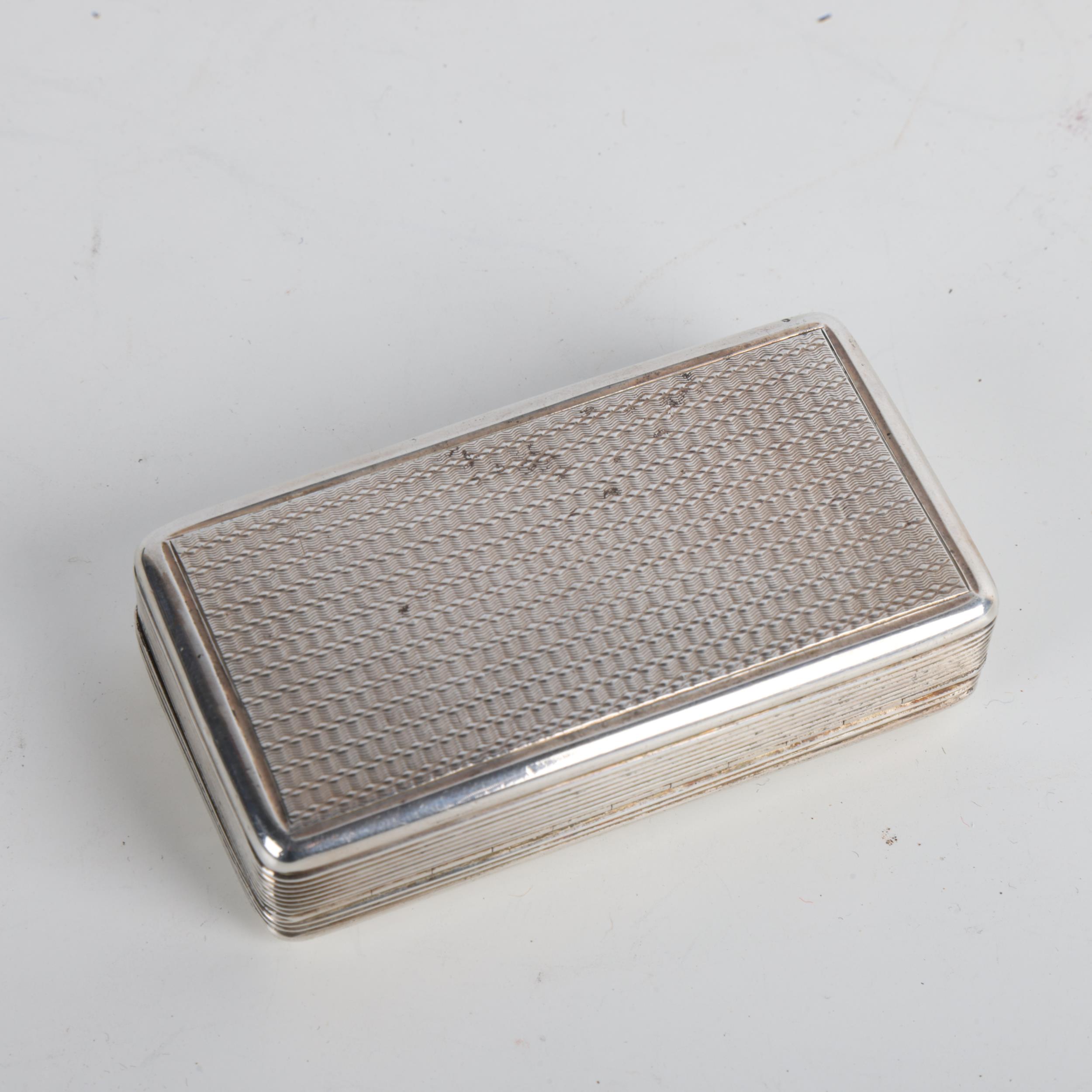 A William IV silver snuffbox, John Bettridge, Birmingham 1832, rectangular form, with engine - Image 2 of 3