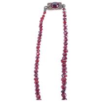 A Regency graduated faceted garnet bead necklace, maker KV, with rose-cut garnet clasp, beads