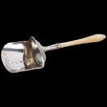A George III silver mother-of-pearl handled shovel tea caddy spoon, Samuel Pearson, Birmingham 1806,