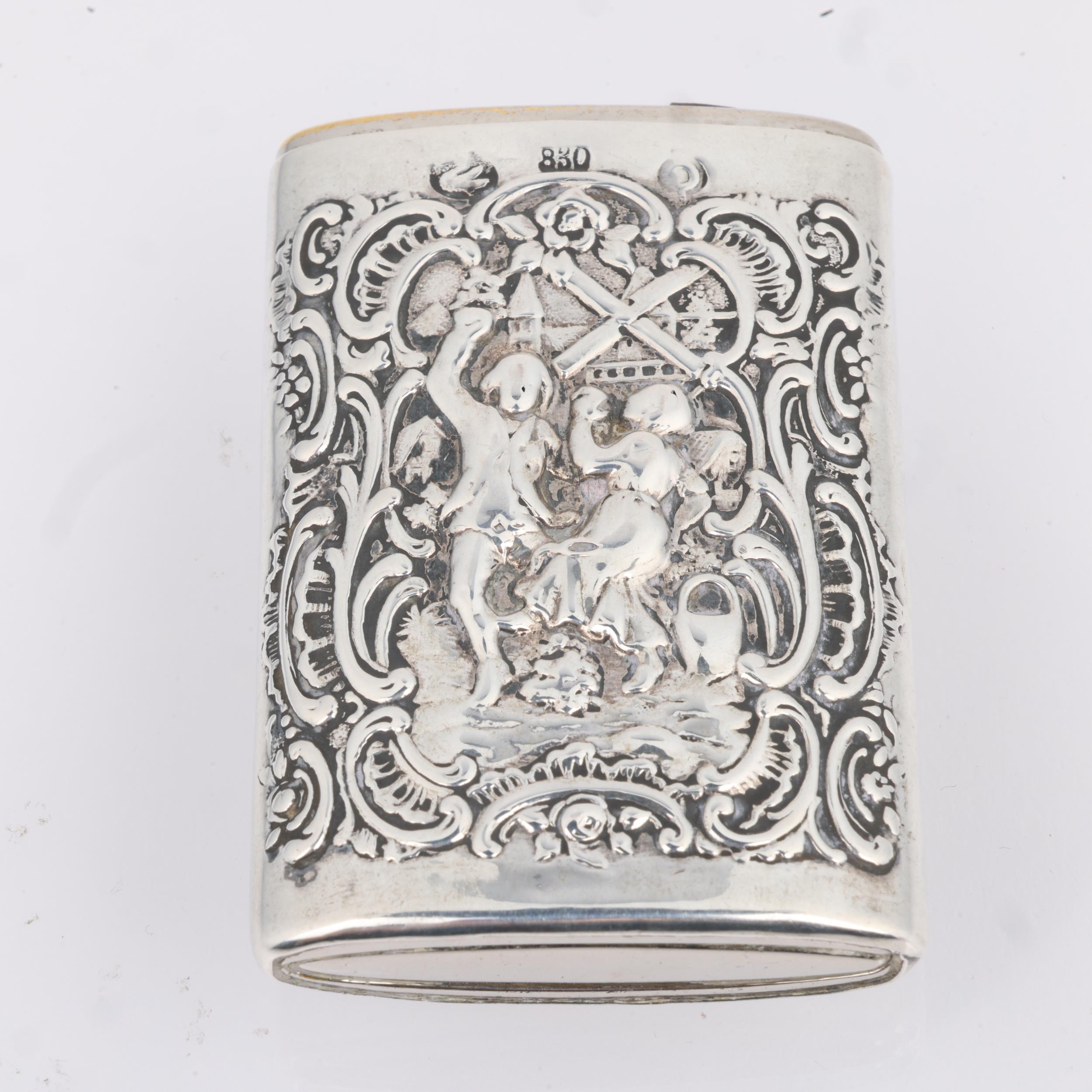 A Continental silver Vesta case, with relief embossed village decoration and sliding action, 6.5cm x - Image 2 of 3