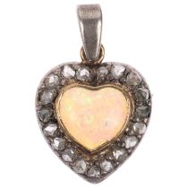 An Antique opal and diamond heart cluster pendant, set with heart cabochon opal, surrounded by