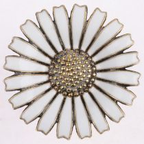 ANTON MICHELSEN - a a Danish modernist sterling silver-gilt white enamel daisy pattern brooch, 32.