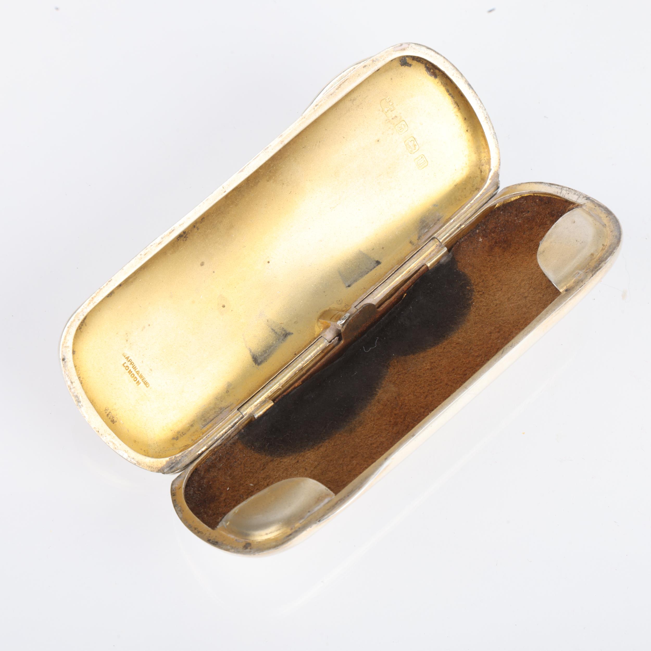 A George V silver spectacles case, Mappin & Webb, Birmingham 1919, oval form with gilt interior, - Image 2 of 3