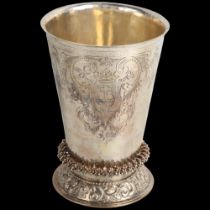 A fine 17th century Dutch silver religious communion beaker, bright-cut engraved crest decoration,