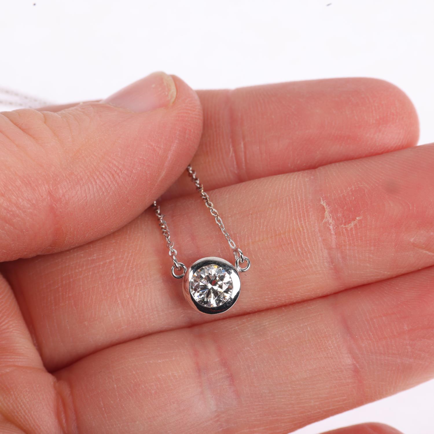 An 18ct white gold 0.5ct solitaire diamond pendant necklace, rub-over set with modern round - Image 4 of 4