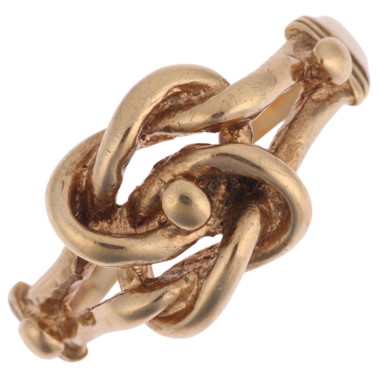A late 20th century 9ct gold knot ring, maker A&AJ, London 1979, setting height 9.9mm, size Q, 3.