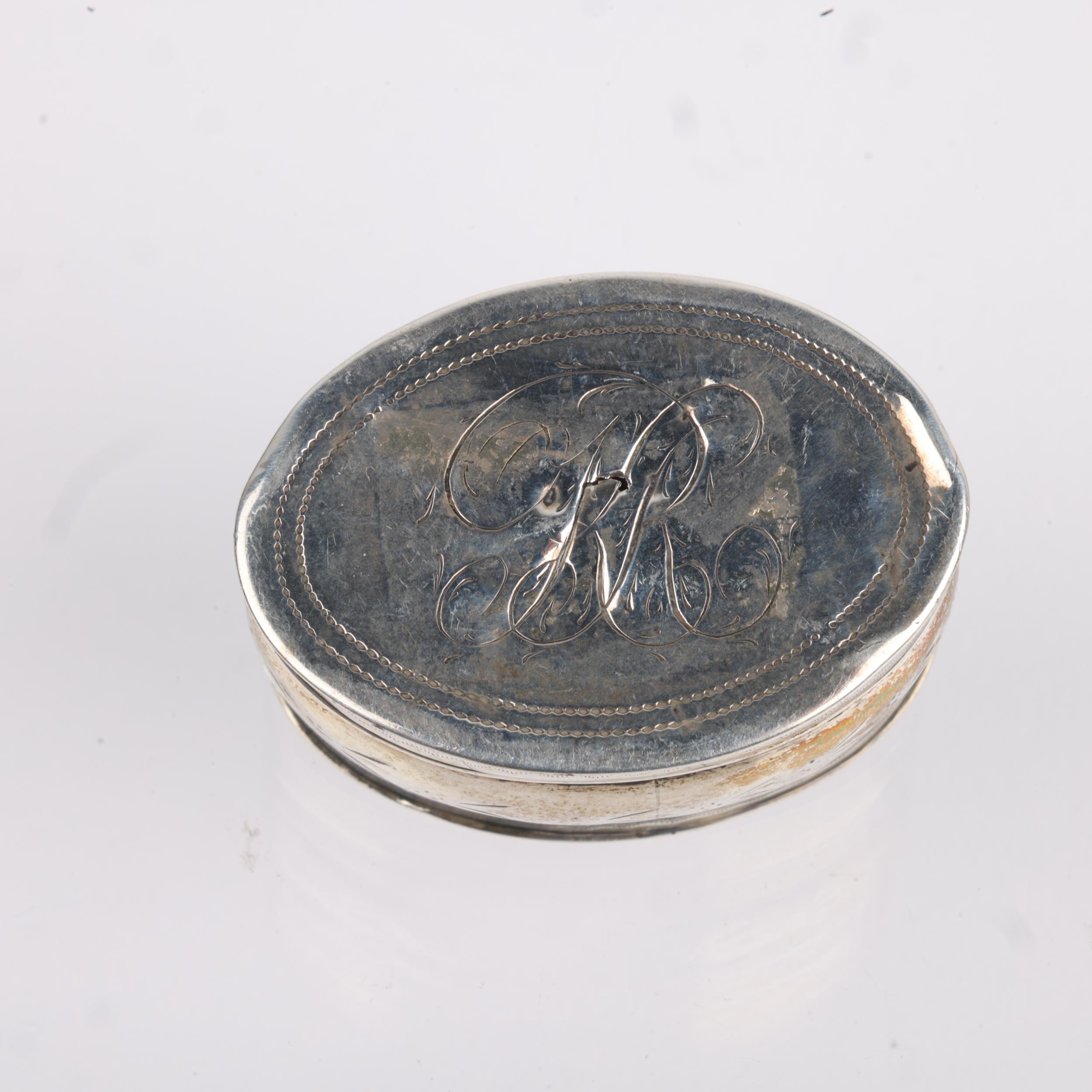 A George III silver nutmeg grater, maker IT, Birmingham 1801, oval bulbous form, with bright-cut - Image 2 of 3