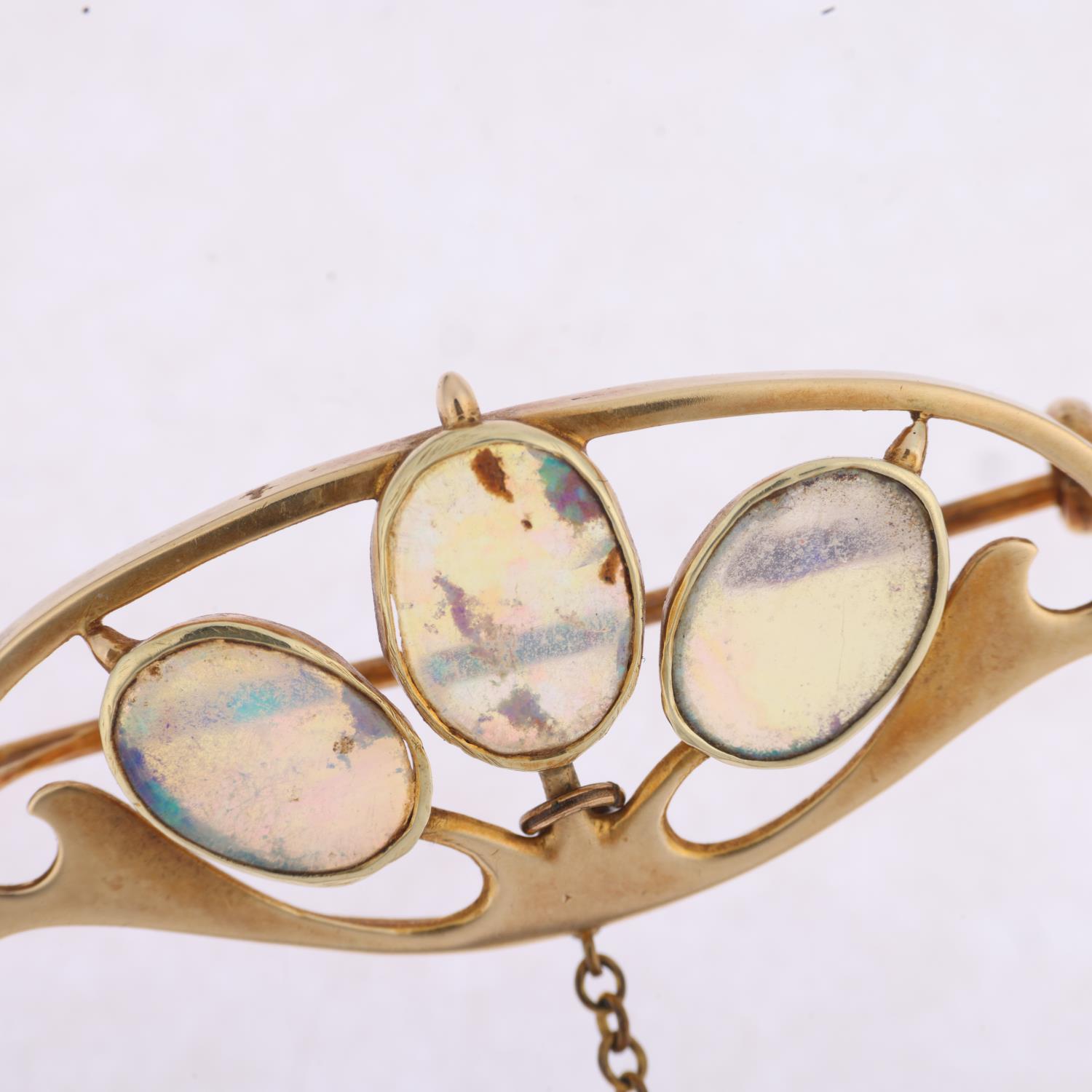 MURRLE BENNETT - an Art Nouveau 15ct gold opal openwork brooch, circa 1905, rub-over set with oval - Image 2 of 4