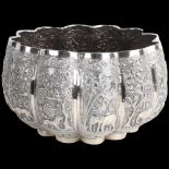 A fine quality Burmese silver Thabeik lobed rice bowl, early 20th century, with panels relief