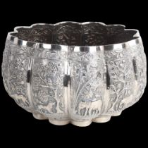 A fine quality Burmese silver Thabeik lobed rice bowl, early 20th century, with panels relief