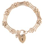 gA late 20th century 9ct gold gatelink chain bracelet, with 9ct heart padlock clasp, 18cm, 15.9g