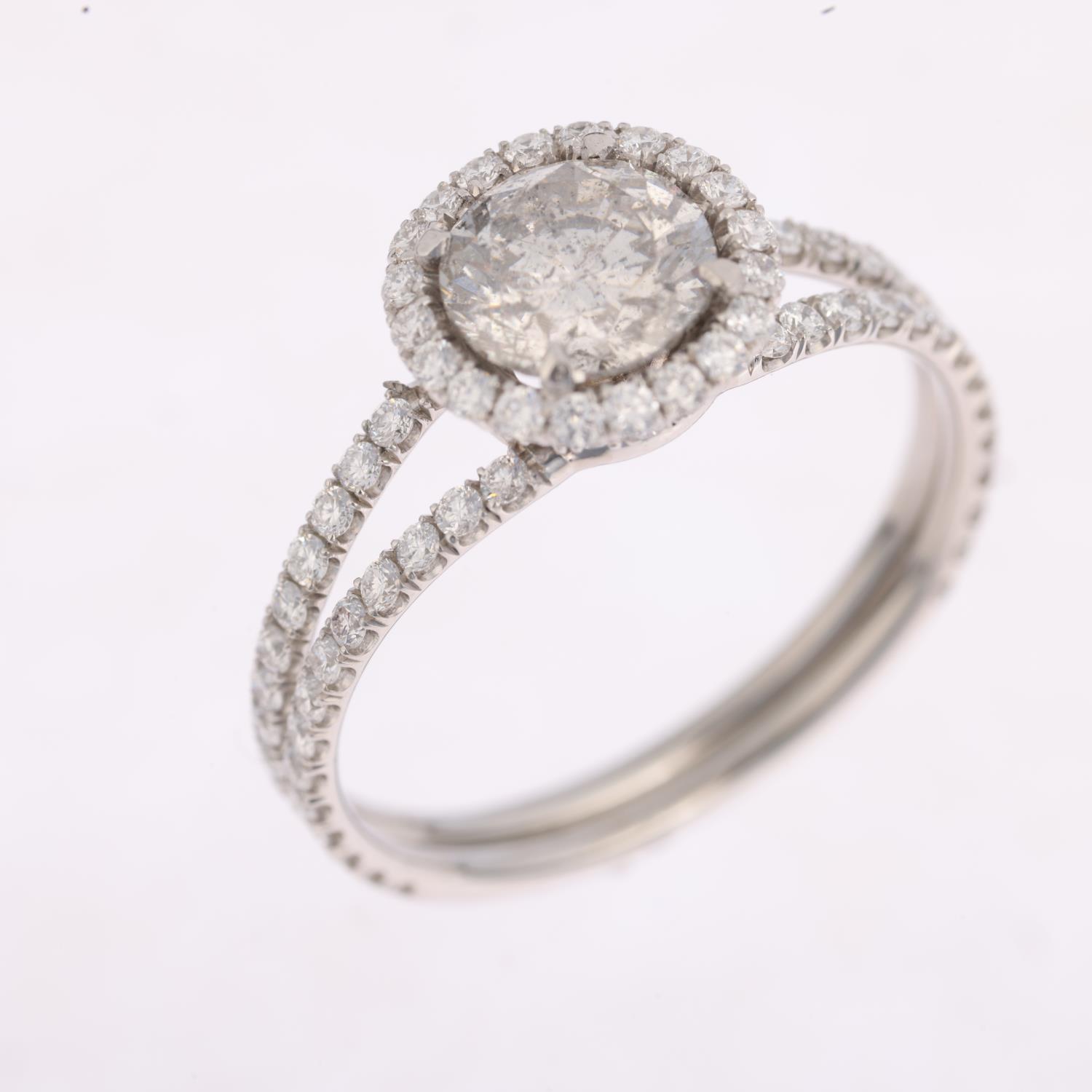 A modern diamond halo cluster ring, centrally set with 1ct modern round brilliant-cut diamond - Image 2 of 4