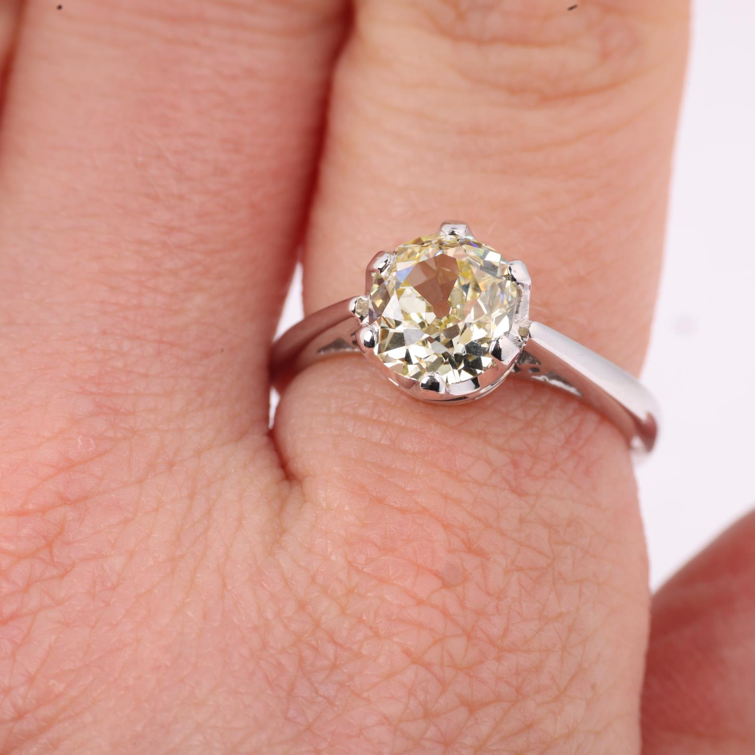 An 18ct white gold 1.9ct solitaire diamond ring, claw set with 1.9ct light yellow old-cut diamond, - Image 4 of 4