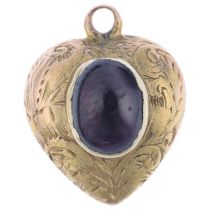 A Victorian garnet heart mourning locket pendant, rub-over set with oval cabochon garnet, with