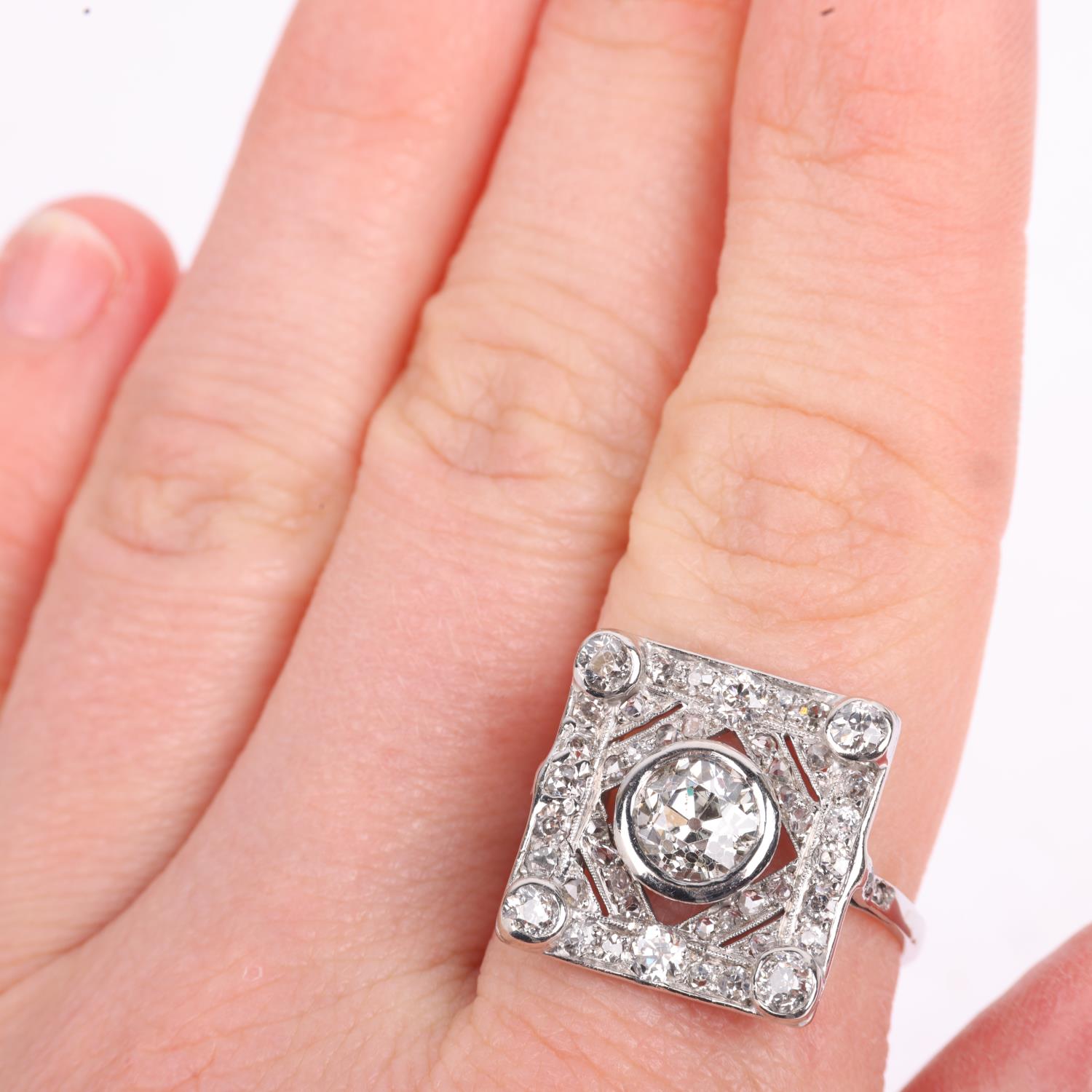 An Art Deco platinum diamond geometric panel ring, centrally set with 1.15ct old European-cut - Image 4 of 4