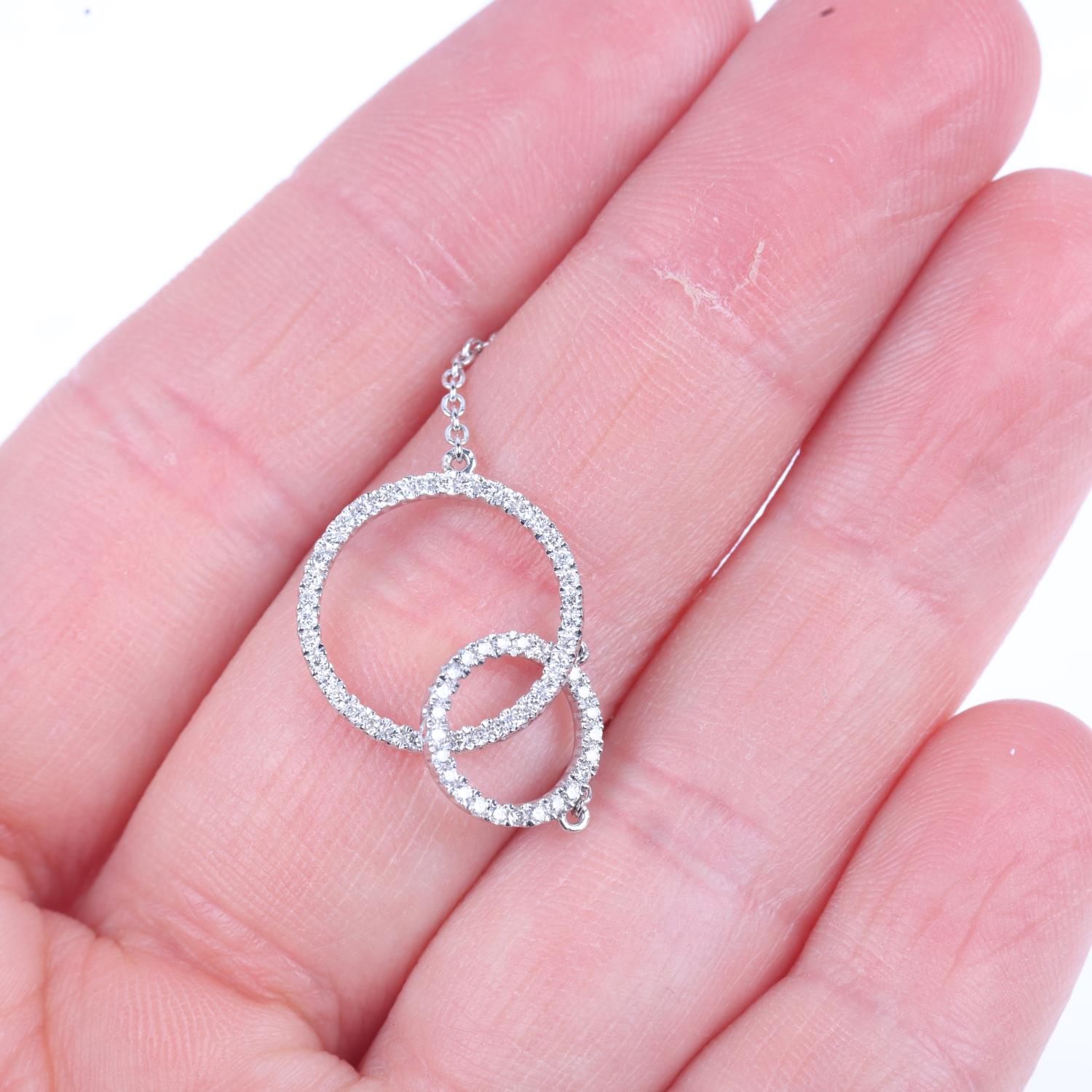 A modern 18ct white gold diamond double-hoop pendant necklace, LD Ltd modelled as 2 interlocking - Image 4 of 4