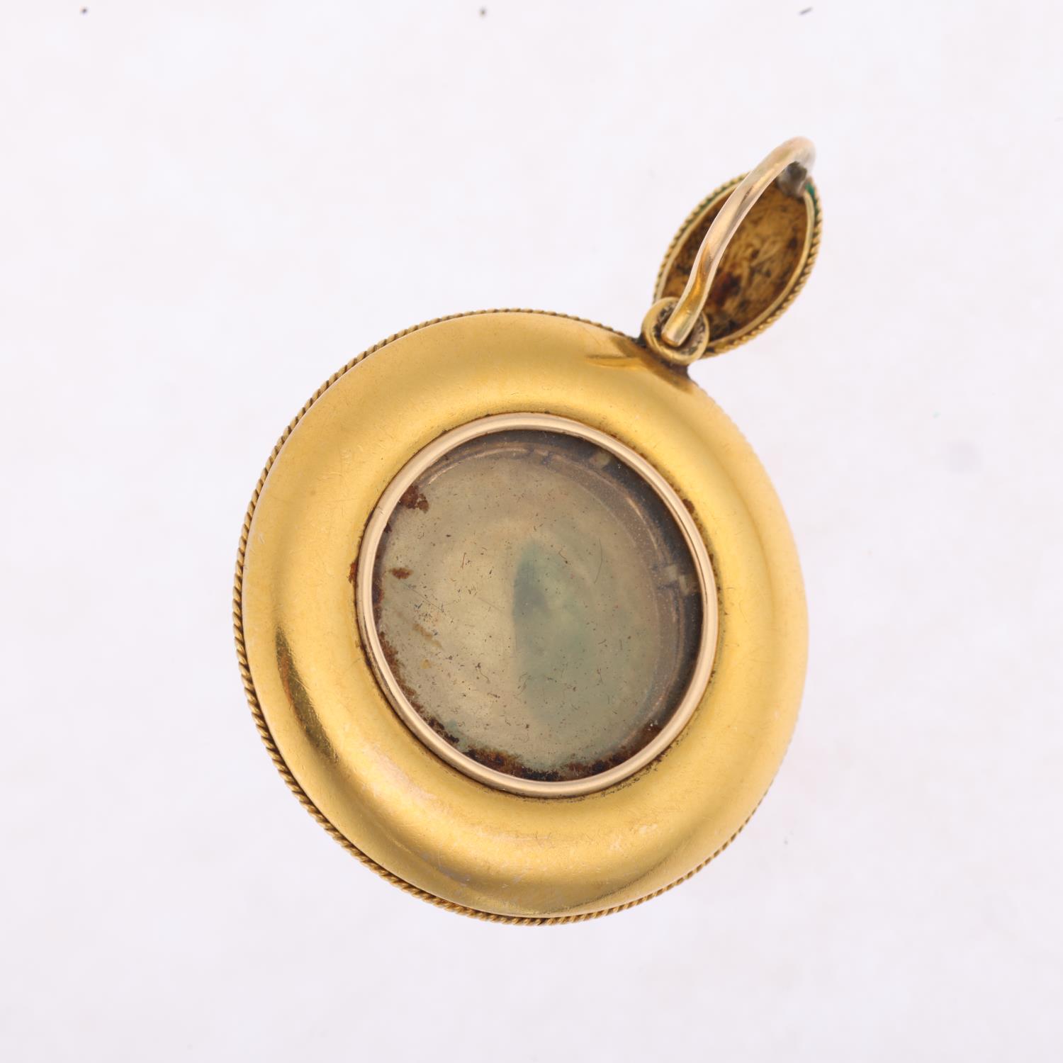 A Victorian Etruscan Revival garnet mourning locket pendant, circa 1880, centrally set with foil- - Image 3 of 4