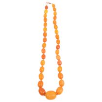 A single-strand graduated butterscotch amber bead necklace, beads measure: 22.3-9.3mm, 46cm, 26g