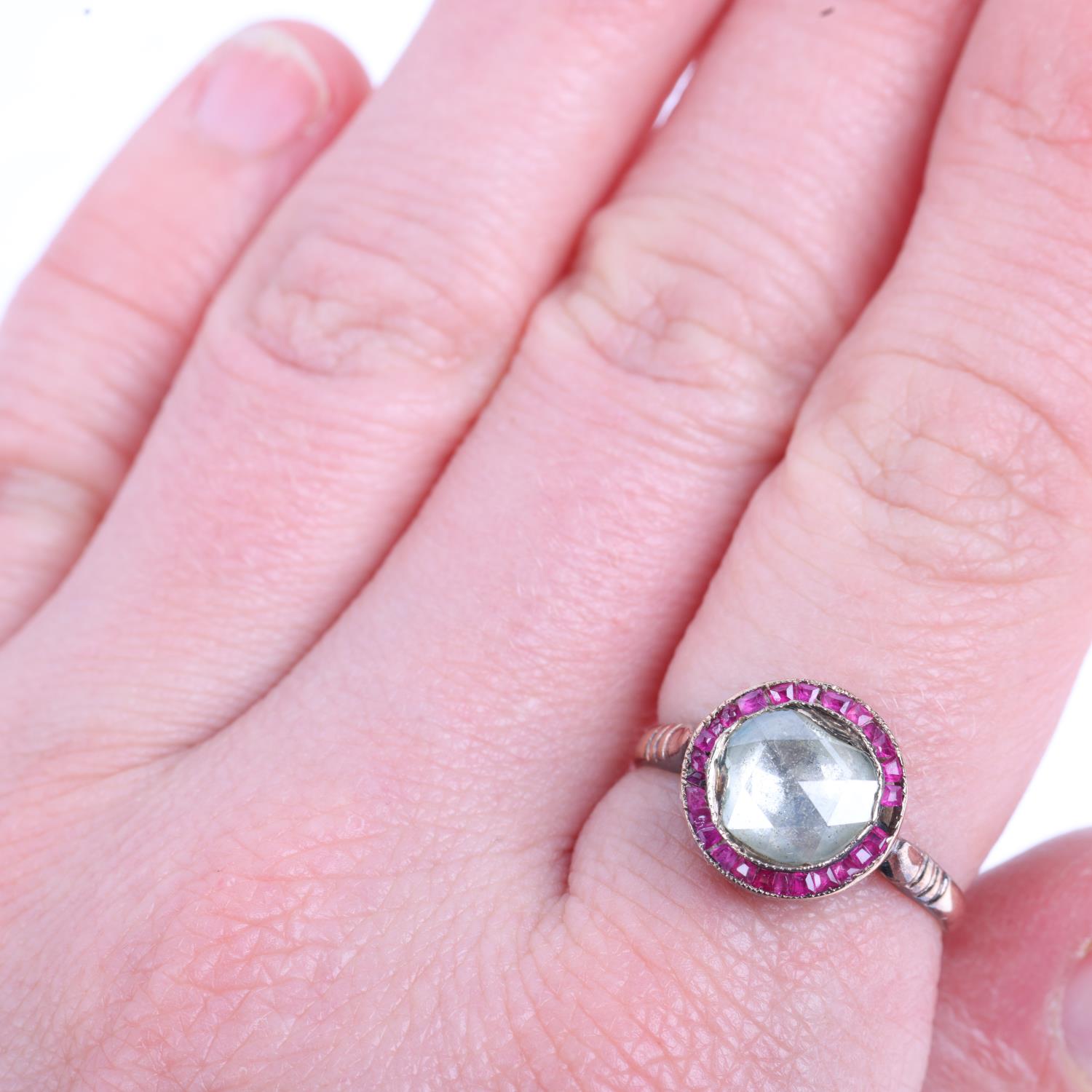 A mid-20th century ruby and diamond target cluster ring, in the Art Deco style, set with 8mm Dutch - Image 4 of 4