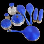 An Art Deco George V silver and blue enamel 9-piece dressing table vanity set, Walker & Hall,
