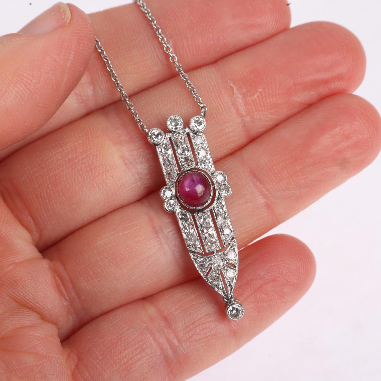 An Art Deco star ruby and diamond openwork geometric pendant necklace, circa 1925, centrally set - Image 4 of 4