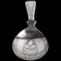 A George III silver tea caddy spoon, no maker, apparently unmarked, 1812, bright-cut floral engraved