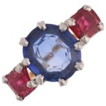 A three stone synthetic sapphire and red paste half hoop ring, apparently unmarked, setting height