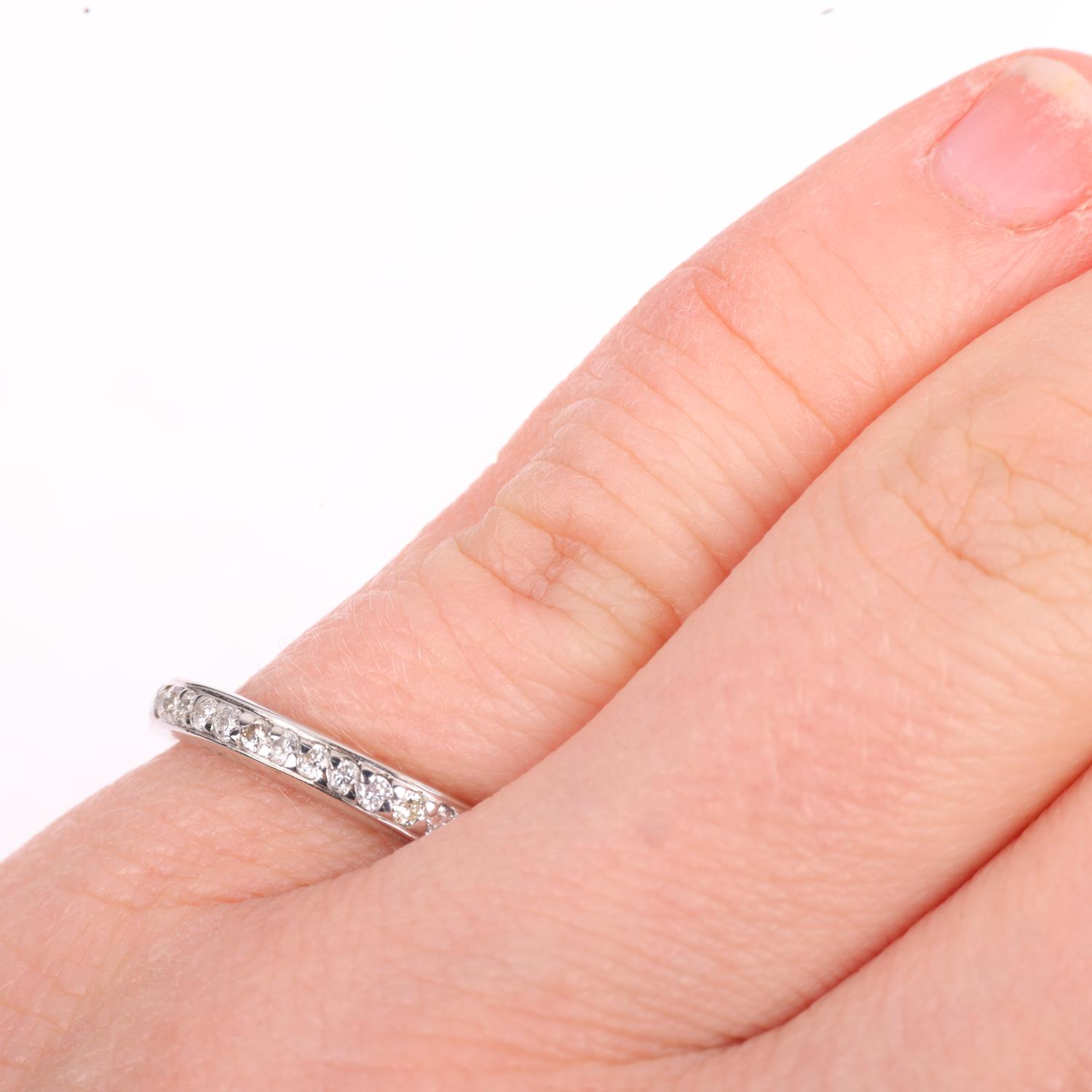 A diamond eternity ring, set with modern round brilliant-cut diamonds, total diamond content - Image 4 of 4