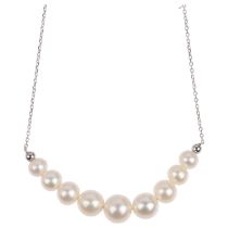 A modern 9ct white gold graduated pearl line necklace, largest pearl 8.2mm, 44cm, 5.1g No damage