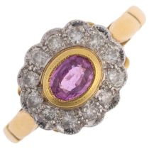 An 18ct gold pink sapphire and diamond flowerhead cluster ring, maker AT Ltd, rub-over set with oval