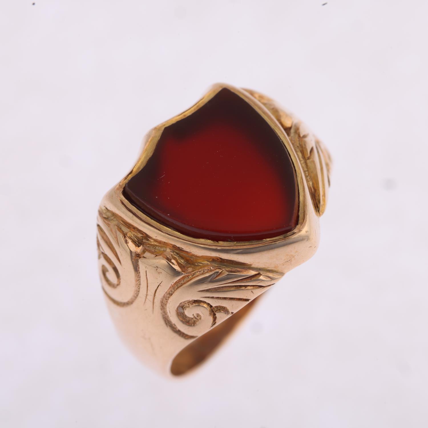 An early 20th century 9ct rose gold carnelian shield seal signet ring, Birmingham 1914, foliate - Image 2 of 4