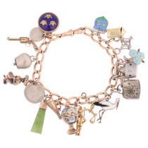 An Antique 15ct rose gold curb link chain charm bracelet, with various gold and silver charms, 18cm,