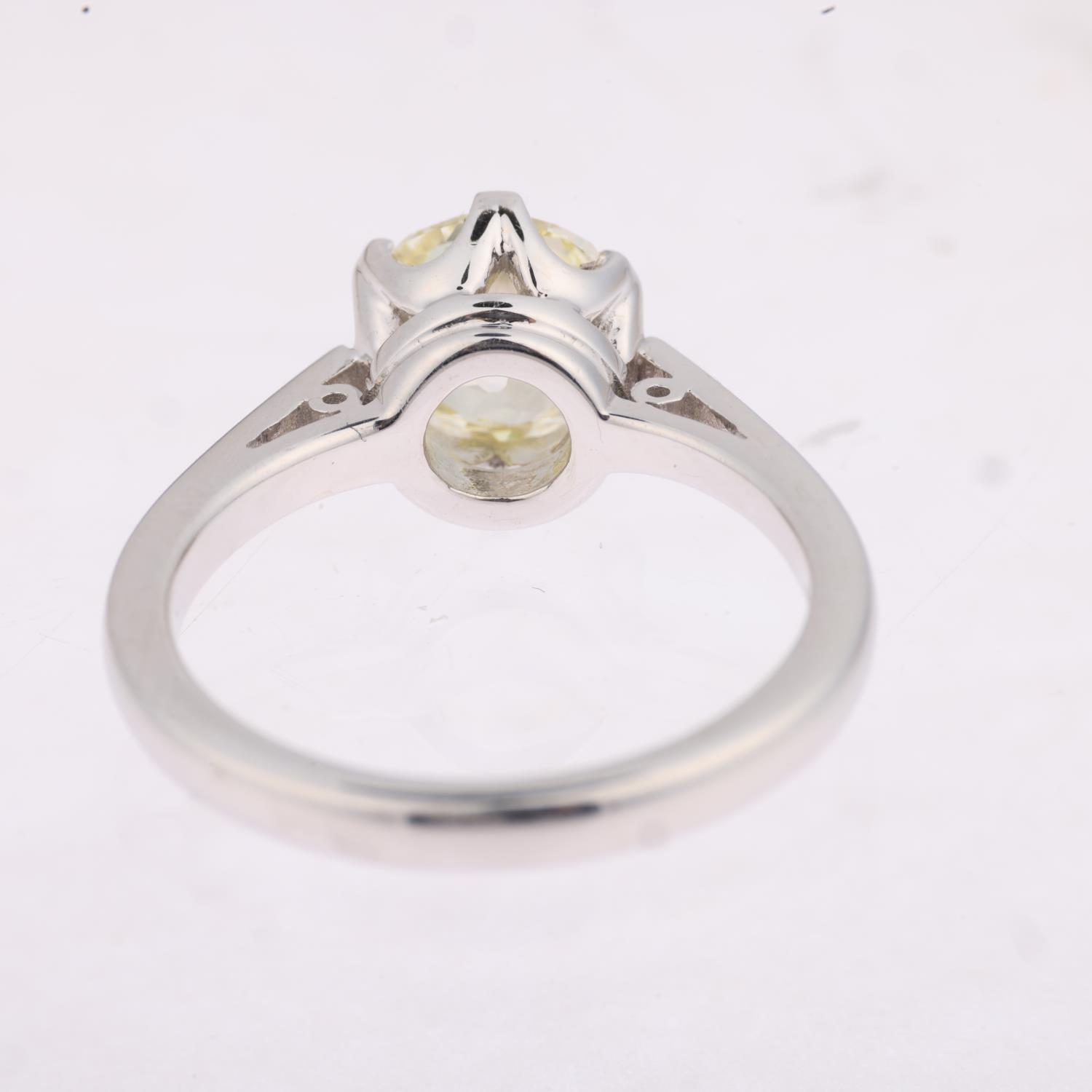 An 18ct white gold 1.9ct solitaire diamond ring, claw set with 1.9ct light yellow old-cut diamond, - Image 3 of 4