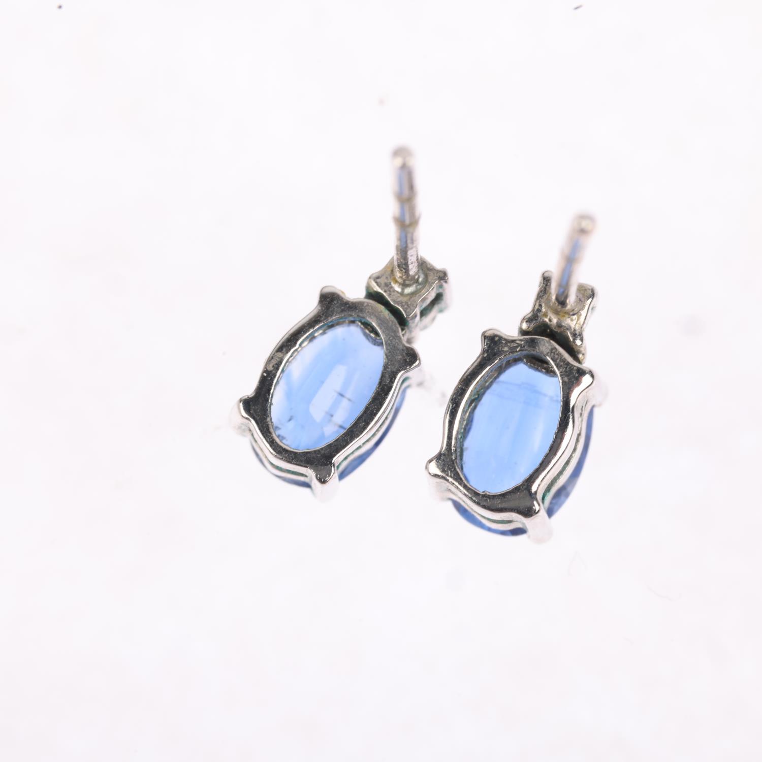 A pair of 9ct white gold sapphire and diamond earrings, set with oval mixed-cut sapphires, rose- - Image 2 of 4